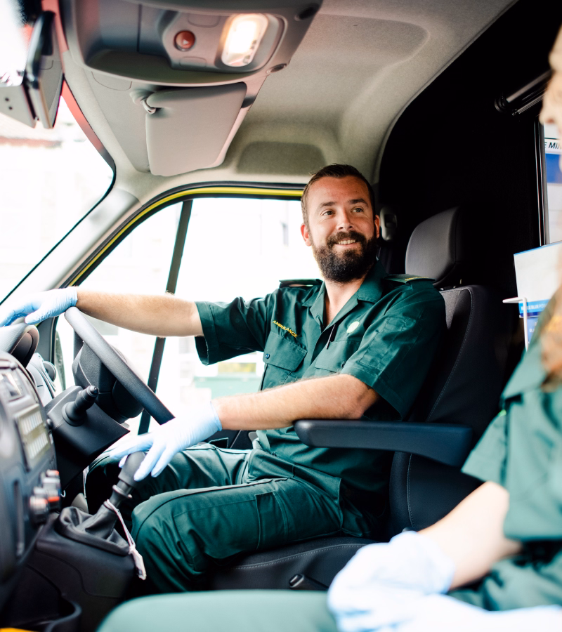 Paramedics preparing an ambulance for patient transport